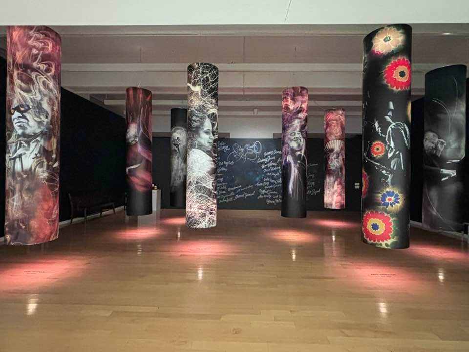 A pear set on a yellow plate upon a soft white canvas texture.